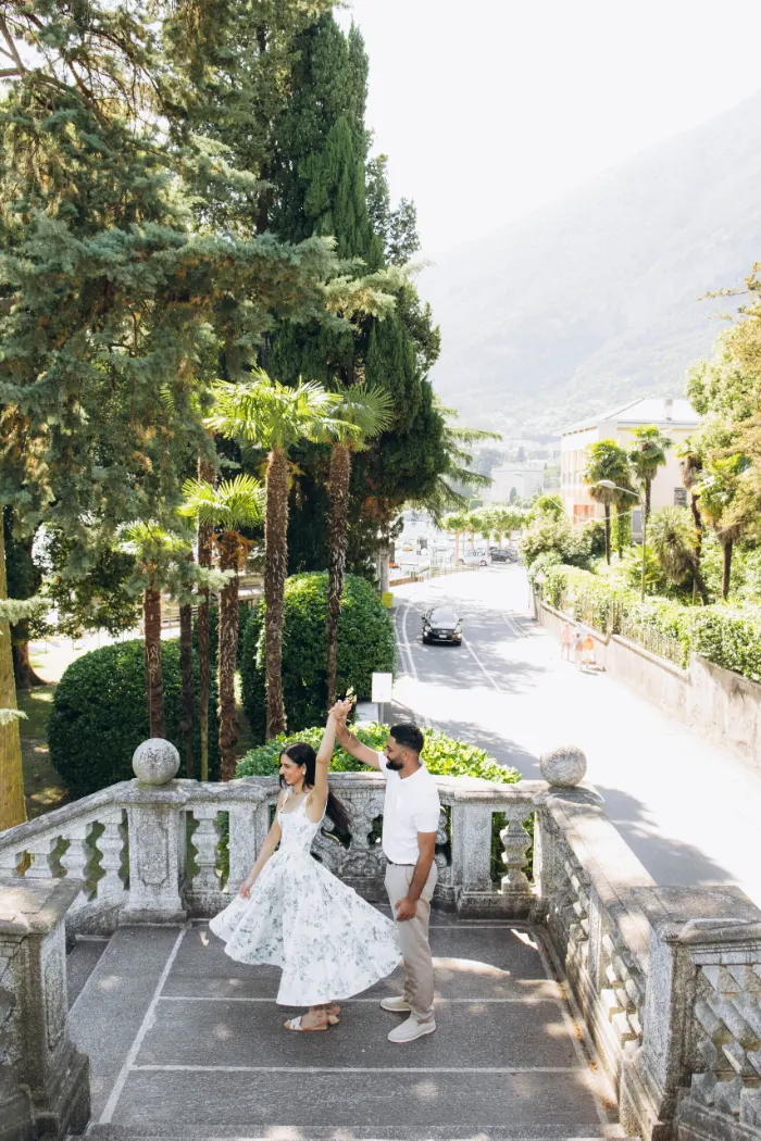 Couple dancing on a terrace above the lake road in Tremezzo, Lake Como