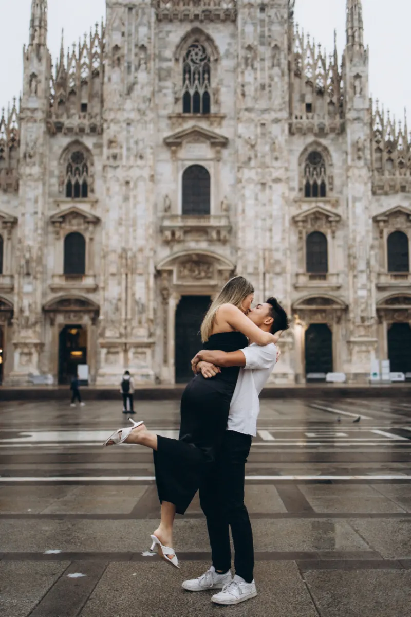 A couple swept off their feet in front of the Duomo in Milan