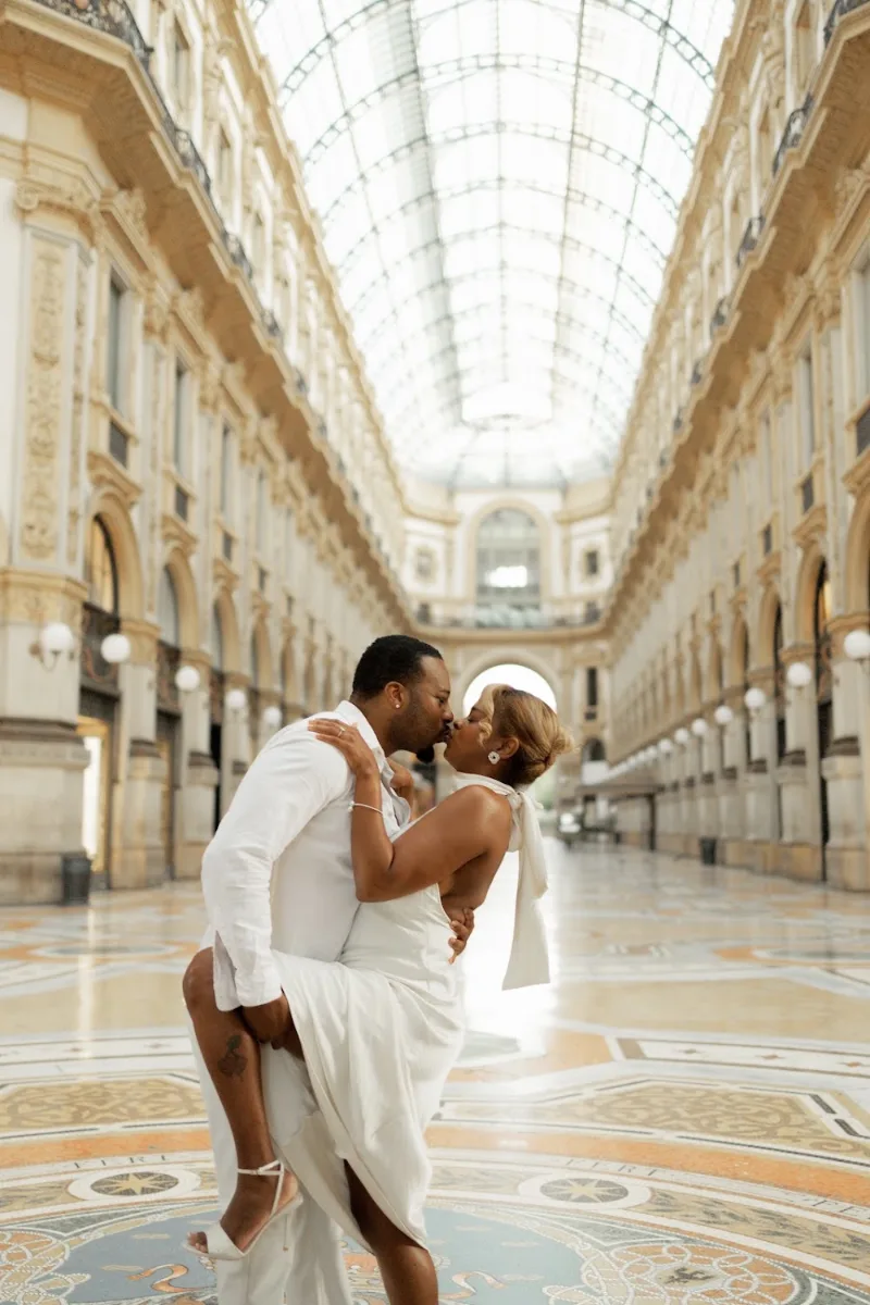 Couple kissing in the empty Galleria Vittorio Emanuele II early in the morning, Milan