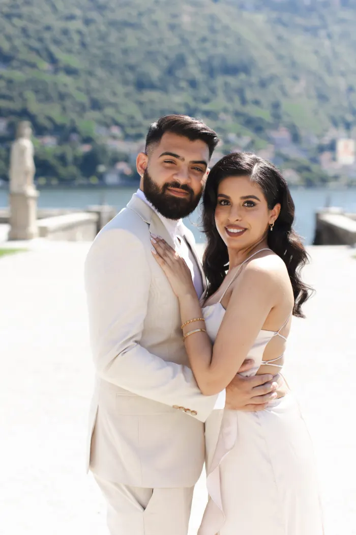 Couple portrait by a villa on the Lake Como waterfront