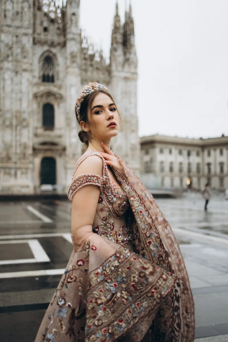 Woman in an embellished gown in front of the Duomo in Milan