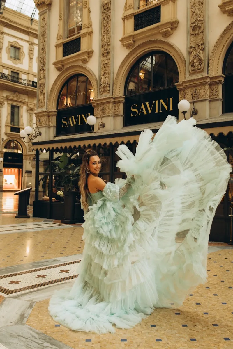 Woman in a mint tulle gown by the Savini café in the Galleria Vittorio Emanuele II