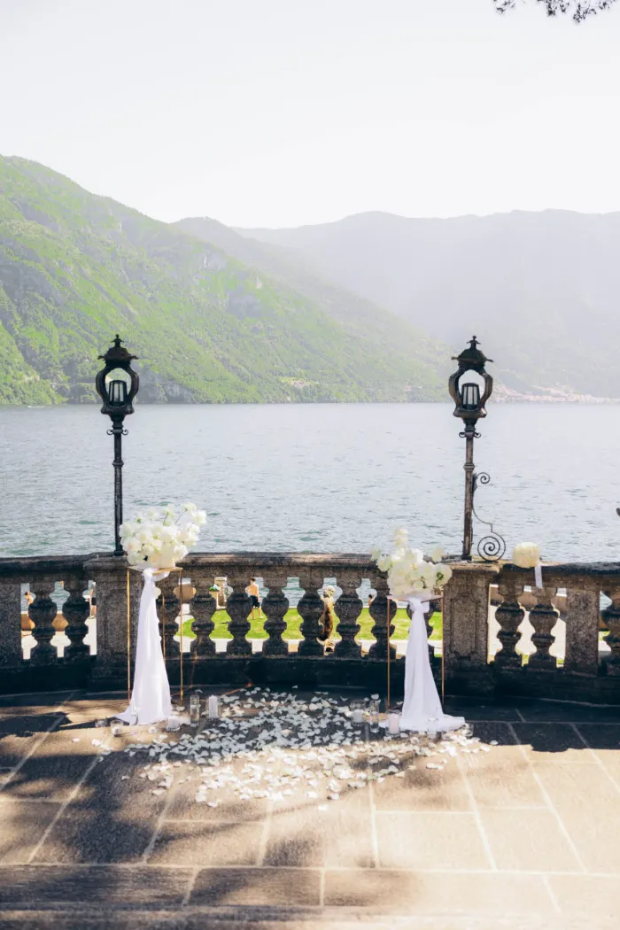 Proposal setup with white roses and lanterns on a terrace in Tremezzo