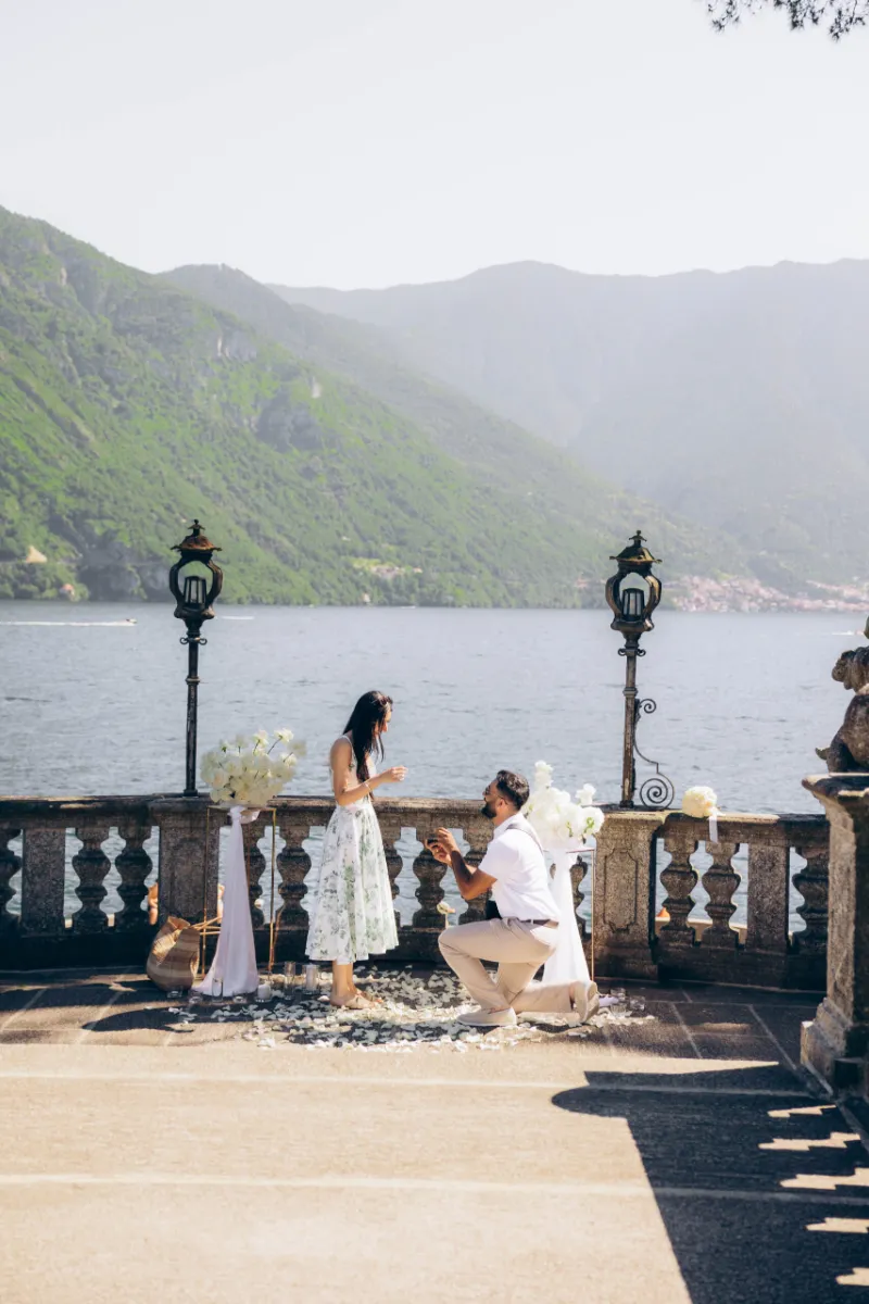 Surprise proposal on a lakeside terrace in Tremezzo, Lake Como