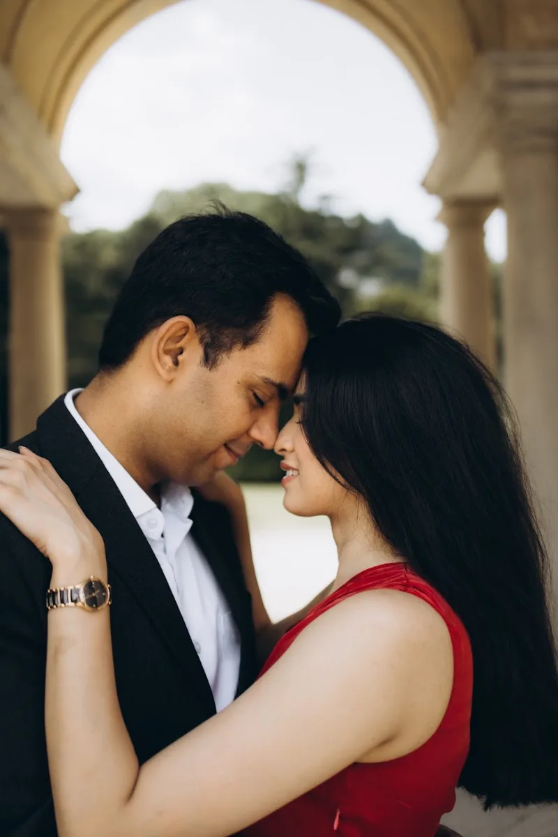 Couple touching foreheads under the pavilion arches of Villa Olmo, Lake Como