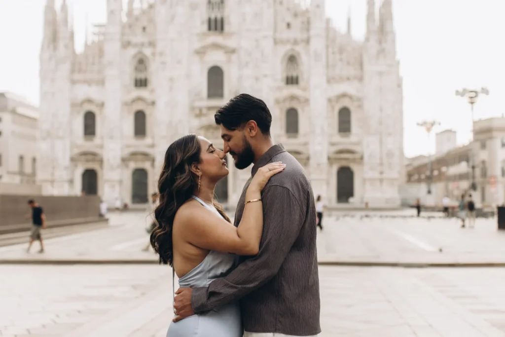 Couple about to kiss in front of the Duomo, Milan