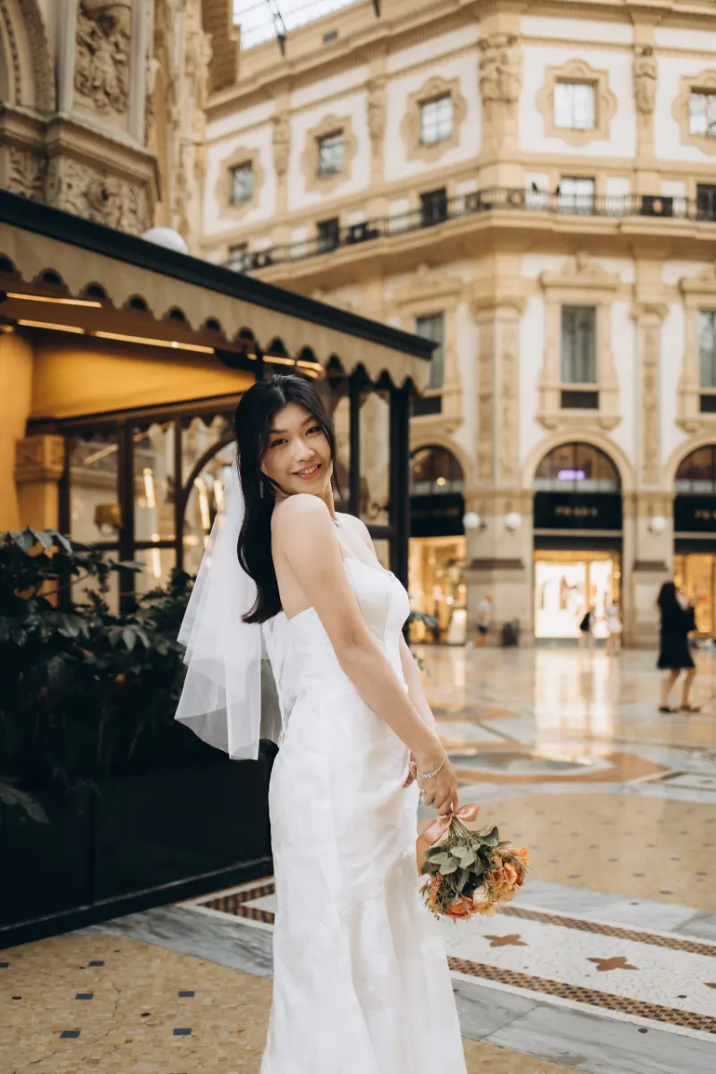 Bride under her veil beneath the glass dome of Galleria Vittorio Emanuele II