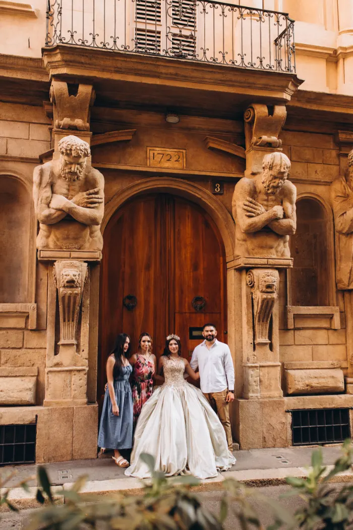 Family at the carved doorway of Casa degli Omenoni, Milan