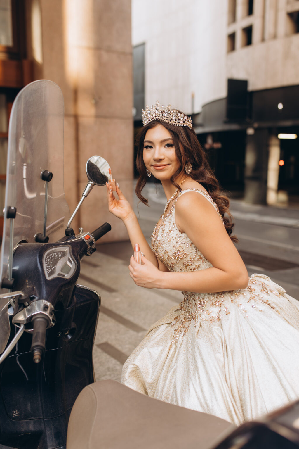 Quinceañera checking her makeup in the mirror of a classic Italian scooter on a Milan street.