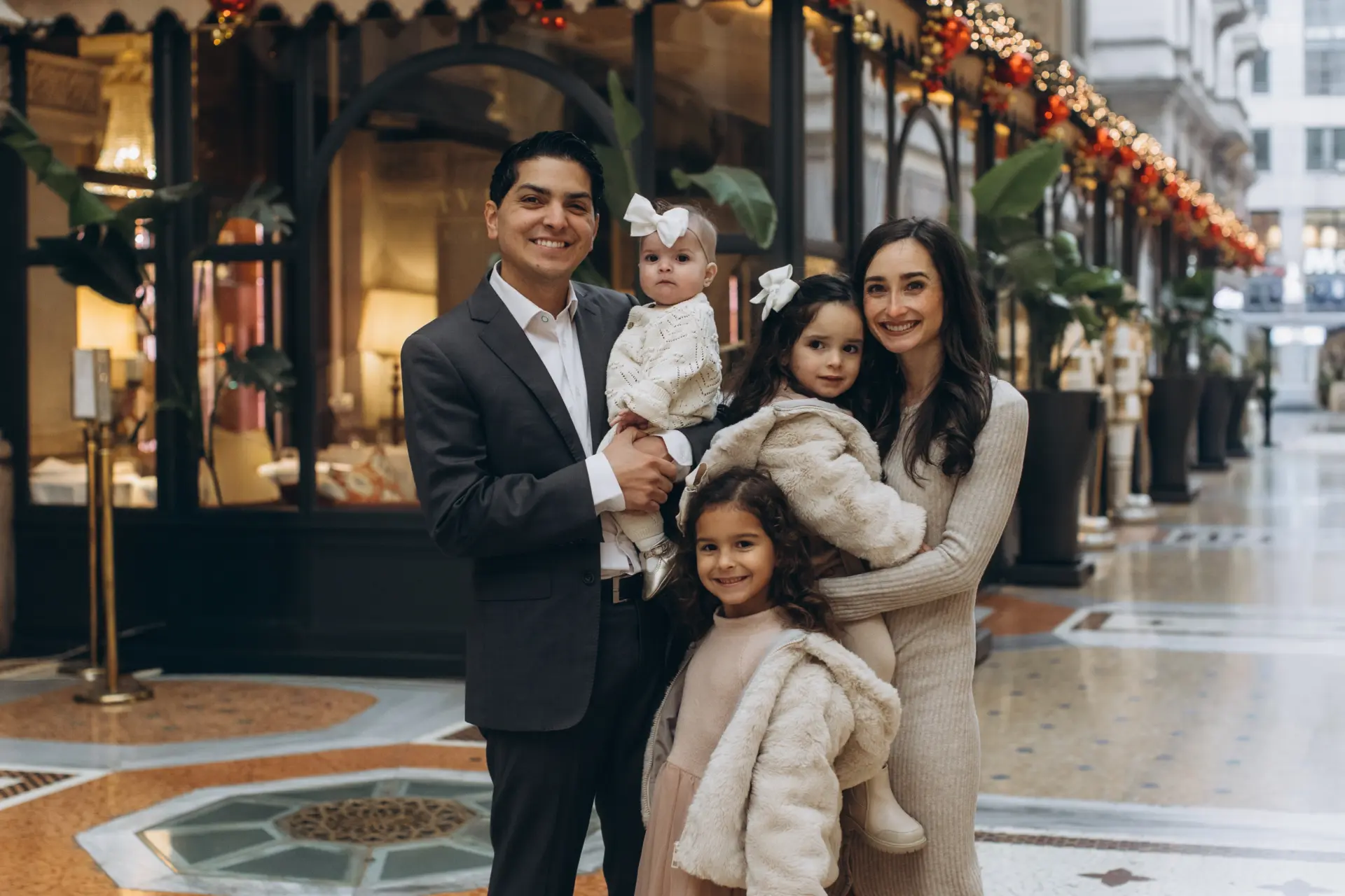 Family with three young children in the Galleria Vittorio Emanuele II, Milan