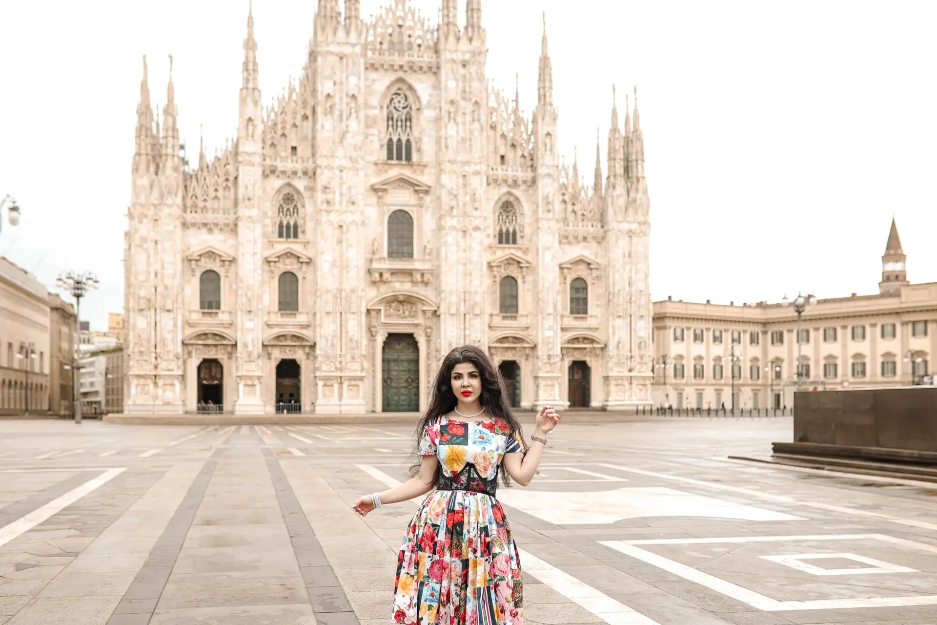 Woman in a floral dress in the empty Piazza del Duomo, Milan